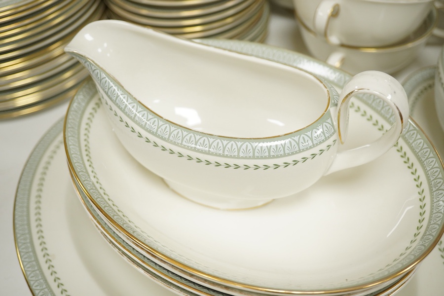 A Royal Doulton Berkshire pattern part dinner service to include tureens, twin handled cups and oval platters, largest 33cm wide. Condition - mostly good